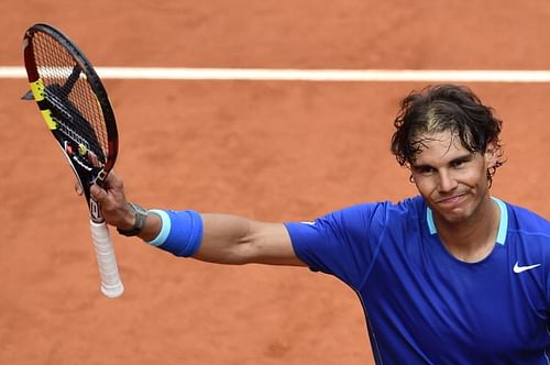 Spanish player Rafael Nadal celebrates after winning his men's singles second round tennis match against Argentinian player Juan Monaco at the Madrid Masters at the Magic Box (Caja Magica) sports complex in Madrid on May 7, 2014.