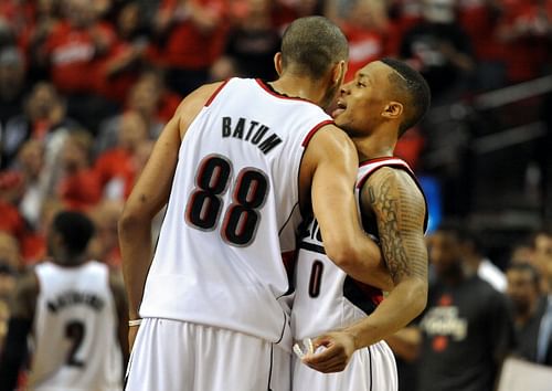 Nicolas Batum #88 of the Portland Trail Blazers greets Damian Lillard #0 of the Portland Trail Blazers after Game Four of the Western Conference Semifinals against the San Antonio Spurs during the 2014 NBA Playoffs at the Moda Center on May 12, 2014 in Portland, Oregon. The Blazers won the game 103-92. 