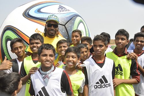 Chris Gayle along with the kids during the adidas FIFA Flag bearers 2014 programme in Mumbai