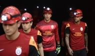 Galatasaray players with their helmets to commemorate the ones who lost their lives following the coal mine fire in Soma, Manisa on May 13, 2014, prior to the match with Kayseri Erciyesspor at Ali Sami Yen Sports Complex on May 17, 2014.
