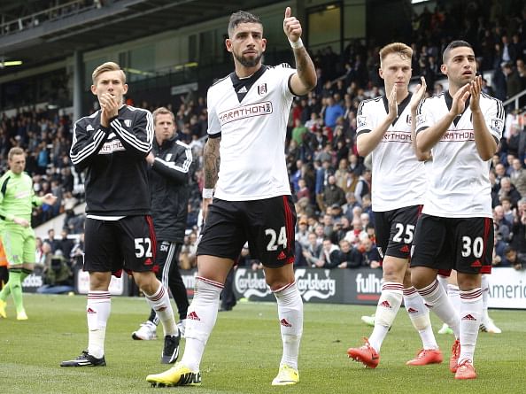 Fulham players applaud their fans after their last Premier League game 