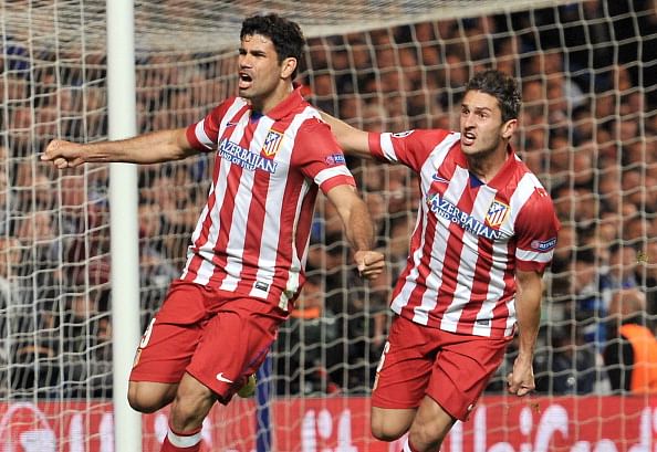 Paul Scholes and Phil Neville scout Koke in Chelsea-Atletico Madrid match