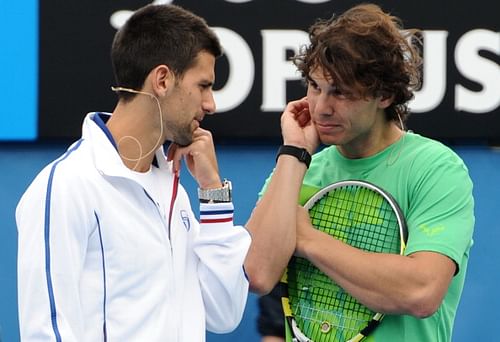 Novak Djokovic of Serbia (L) speaks with