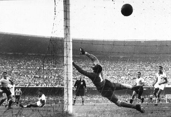 Uruguay&acirc;€™s Ghiggia (L) scores the winning goal past the dive of Brazilian goalkeeper Barbosa to win the World Cup for Uruguay and complete a major by upset by beating hosts and favourites Brazil.