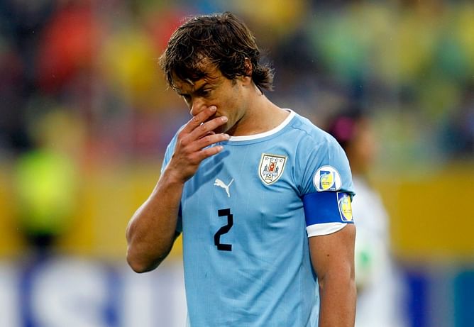 Uruguay captain Lugano to miss England game