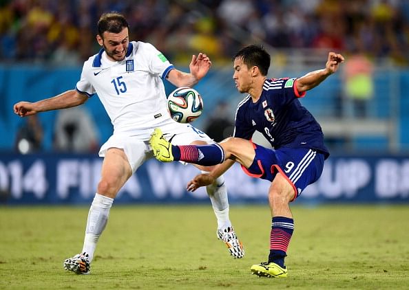 FIFA World Cup 2014: Ten man Greece holds Japan goalless