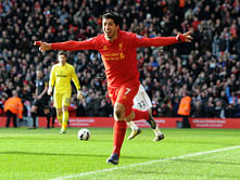 Should Luis Suarez stay at Liverpool or move to Barcelona?