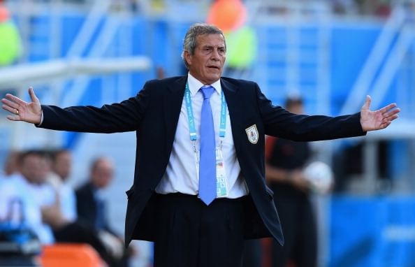 Uruguay coach Tabarez defends Suarez against biting claims