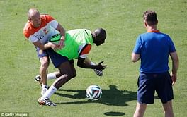Arjen Robben clashes with Netherlands teammate Bruno Martins Indi during training