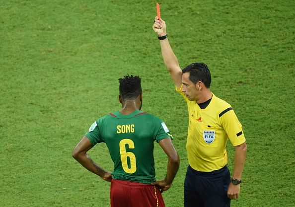 Cameroon's Alex Song banned for three games for violent behaviour at World Cup