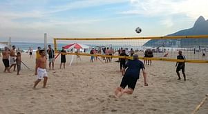 Arsene Wenger makes Van Persie-like diving header in beach volleyball game in Brazil