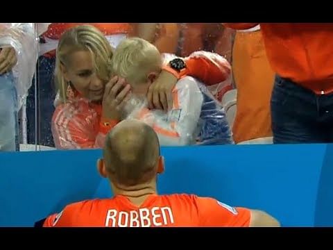 Netherlands' Arjen Robben consoles his son who is in tears after defeat against Argentina