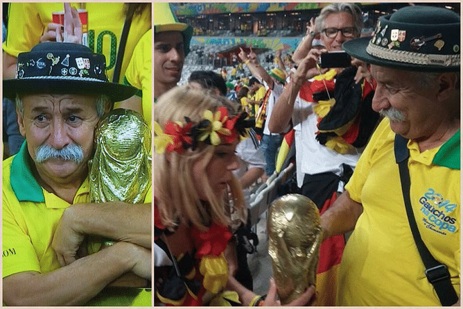 The sad Brazilian fan who was holding the World Cup trophy following Brazil's elimination