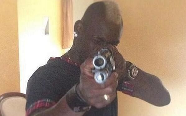 Mario Balotelli posts a photograph of himself posing with a gun on Instagram