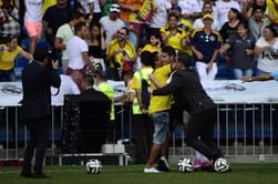 James Rodriguez's hugs pitch invader during his presentation at Santiago Bernabeu