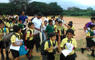 Mayank Agarwal interacts with children at the batting clinic