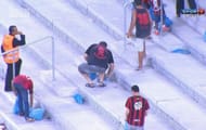 Atletico Paranense fans pick trash