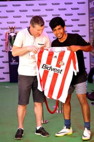 Tejas with Manchester United legend Dennis Irwin, after he won the Freestyle football competition at the Channel V fest 2013