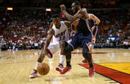 Norris Cole #30 of the Miami Heat drives on John Wall #2 of the Washington Wizards