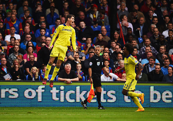 Oscar of Chelsea (L) celebrates with Willian (R) as he scotres their first goal from a free kick during the Barclays Premier League match between Crystal Palace and Chelsea at Selhurst Park on October 18, 2014 in London, England.