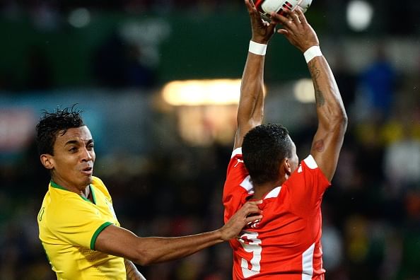 Video: Austrian forward Okotie's terrible "Hand of God" attempt against Brazil