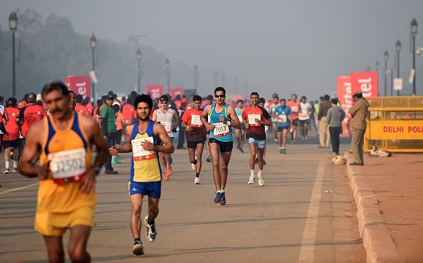 Over 31000 runners plus celebrities participate at the 2014 Delhi Marathon