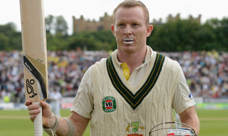 Chris Rogers raises his bat