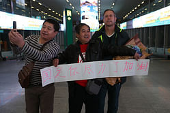 Chinese footballers get warm welcome despite Asian Cup exit