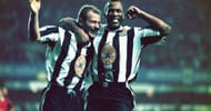Newcastle strikers Alan Shearer (l) and Les Ferdinand celebrate a goal during the Premiership match between Newcastle United and Manchester United at St Jame's Park on October 20, 1996 in Newcastle, England. Newcastle won the game 5-0.