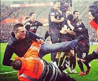 Video: Steward stops Liverpool pitch invader with insane 'Rock Bottom' move