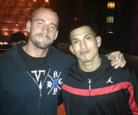 CM Punk walking UFC champion to the cage, cool wrestling photos, WrestleMania 31 note, more