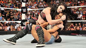 Paige and AJ Lee looking for new tag team name, Rey Mysterio match delayed, Roman Reigns focused