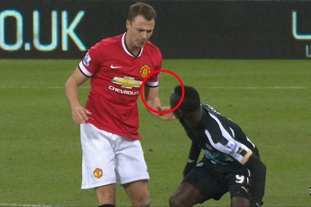 Video: Spitting storm! Jonny Evans and Papiss Cisse caught spitting at each other