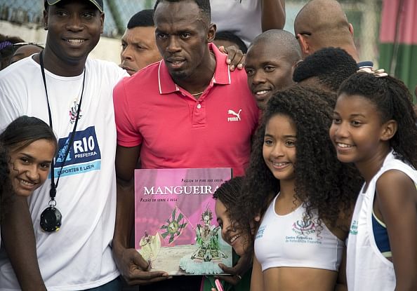 Usain Bolt continues Rio goodwill tour