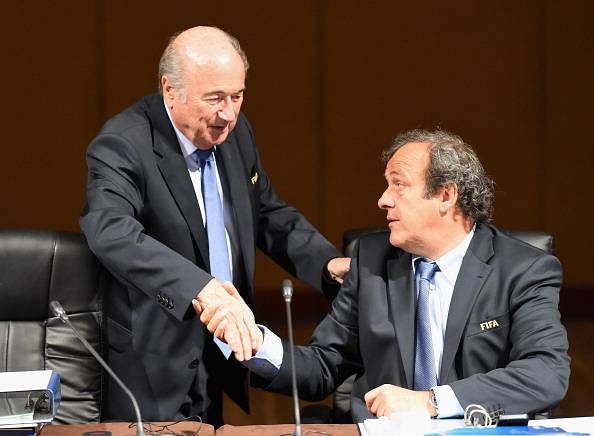 UEFA chief Michel Platini asks FIFA boss Sepp Blatter to step down