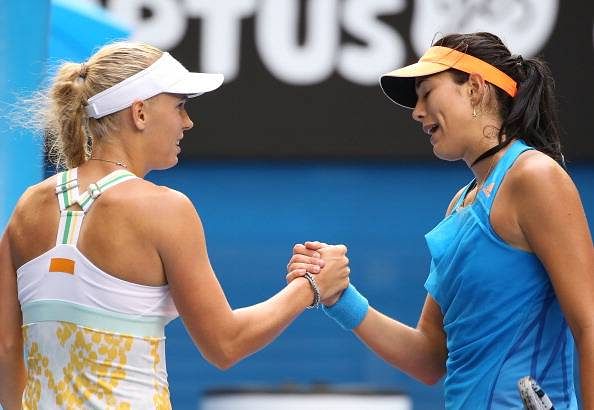 Muguruza charges into French Open third round