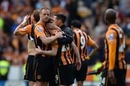 David Meyler (L) consoles Stephen Quinn (R) after the final whistle of the match