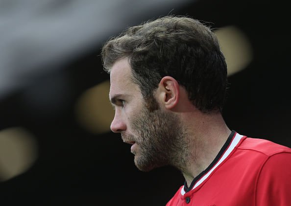 Manchester United midfielder Juan Mata backs goalkeeper Victor Valdes
