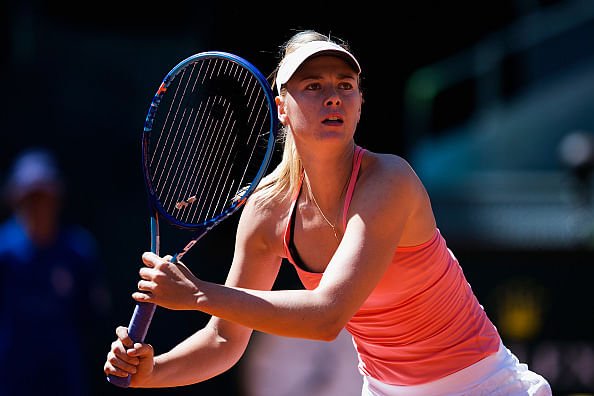 Maria Sharapova survives a scare against Caroline Garcia to reach the quarterfinals of Madrid Open