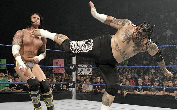 Umaga aiming a vicious kick at CM Punk&acirc;s throat