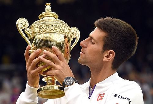 Novak Djokovic poses with the Wimbledon titleÂ 