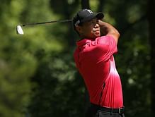 Video: Tiger Woods hits an incredible recovery shot at Quicken Loans National