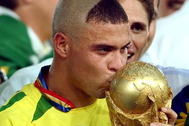 Ronaldo Nazario looks at his 2002 FIFA World Cup winners trophy