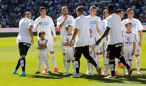 Young Syrian refugee Zied enters Santiago Bernabeu as mascot alongside Cristiano Ronaldo