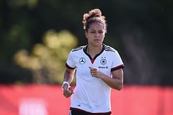 Why did former German International Celia Sasic retire at 27 ?