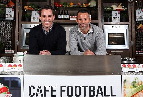 Gary Neville and Ryan Giggs help out some homeless people during UK's bitter winter