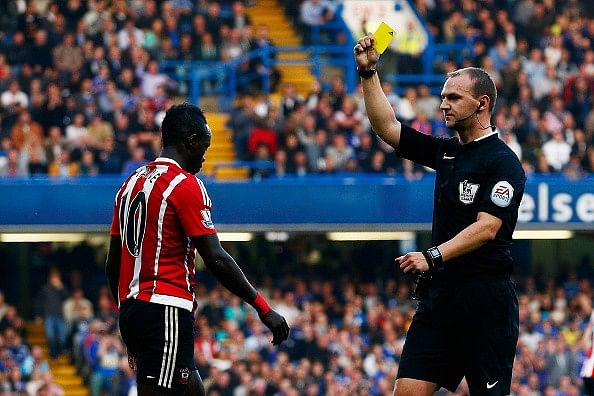 Referee Sadio Mane yellow card