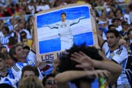 Argentina fans with a Lionel Messi placard