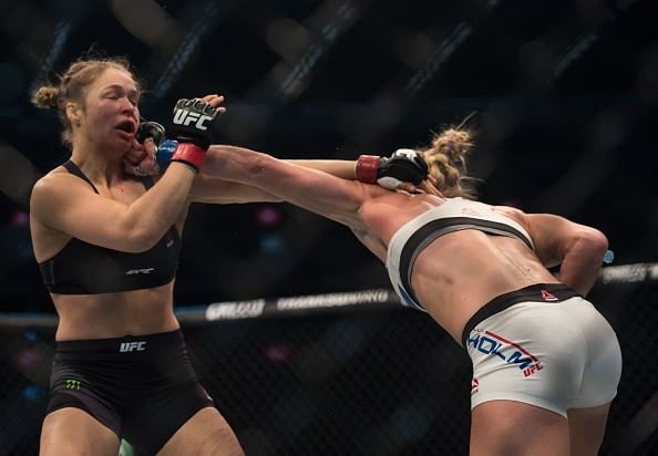 Video: Ronda Rousey hides her bruised face from cameras on returning home