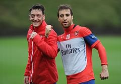 Girl unknowingly asks Arsenal stars Mesut Ozil and Mathieu Flamini to take her photo at a club